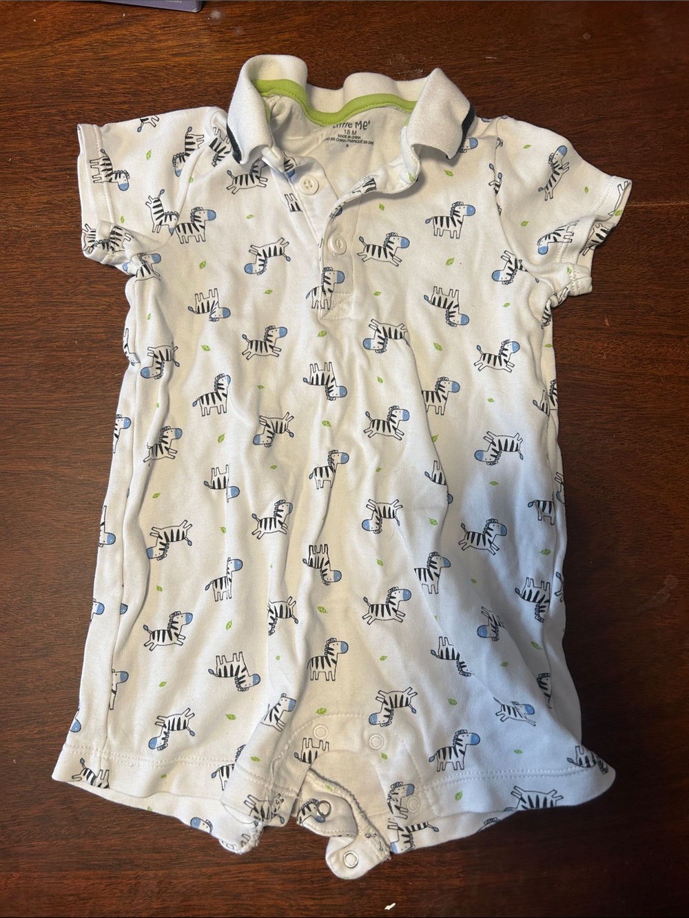 Little Me White Polo Romper with Blue Zebra Print and Green Accents